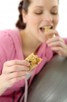 Girl Eating a Power Packed Pre-Workout Snack
